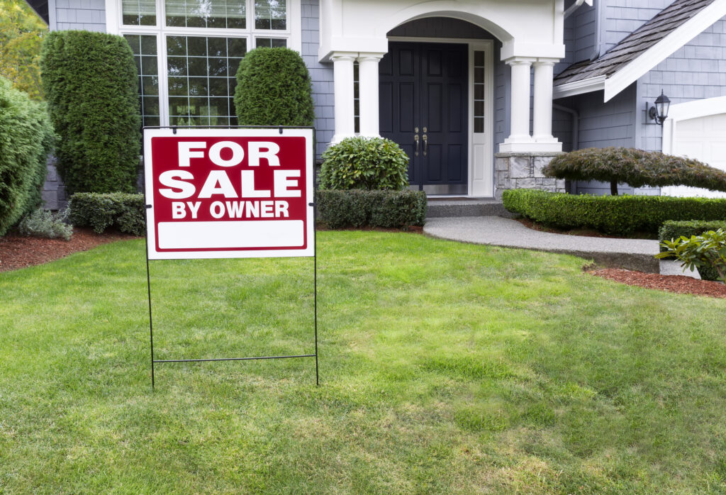 for sale by owner sign in yard of house